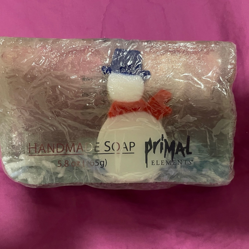 Primal handmade winter themed soap bar featuring a dapper snowman